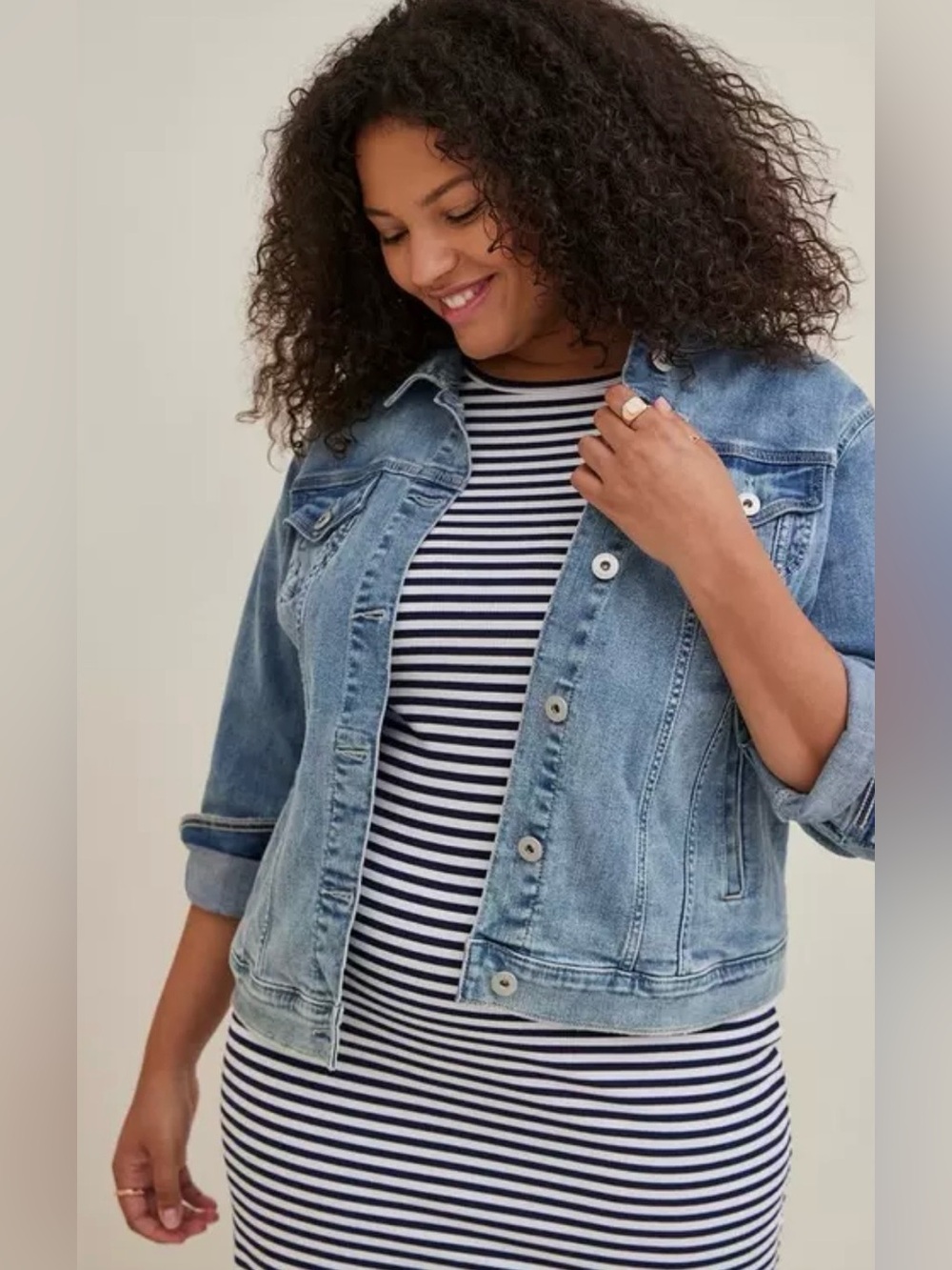 light-wash Torrid denim jacket with a classic button-down front.